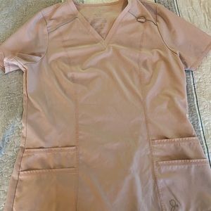 Jaanuu light pink scrub top size M.